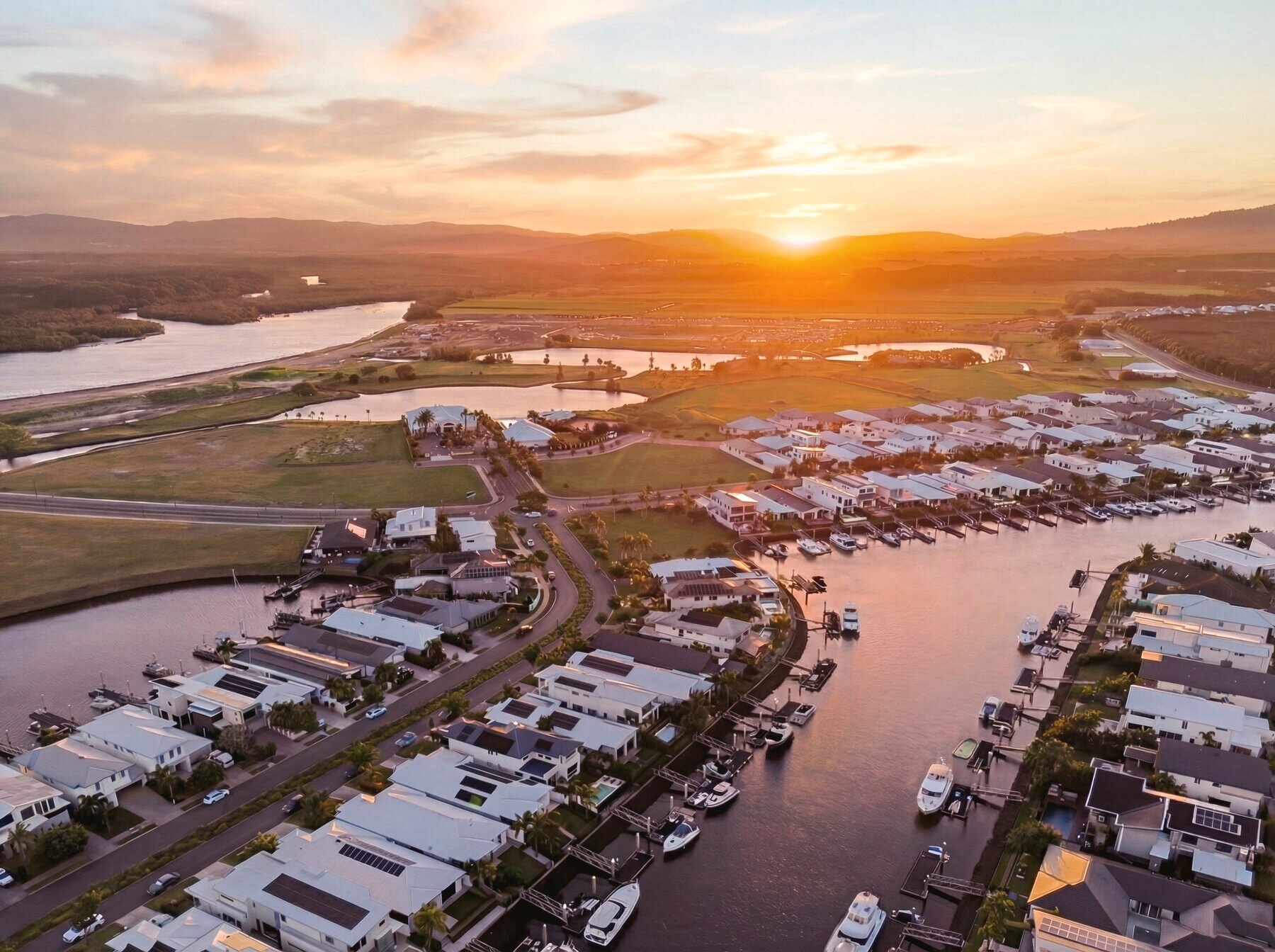 Aerial of the Calypso Bay canal estate at golden hour